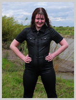  Miss Abigail takes a spectacular mudbath in a tight fitting coated denim jumpsuit featuring Miss Abigail, Mistress of Many Kinks 