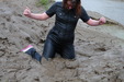 view details of set gm-4m051, Miss Abigail takes a spectacular mudbath in a tight fitting coated denim jumpsuit